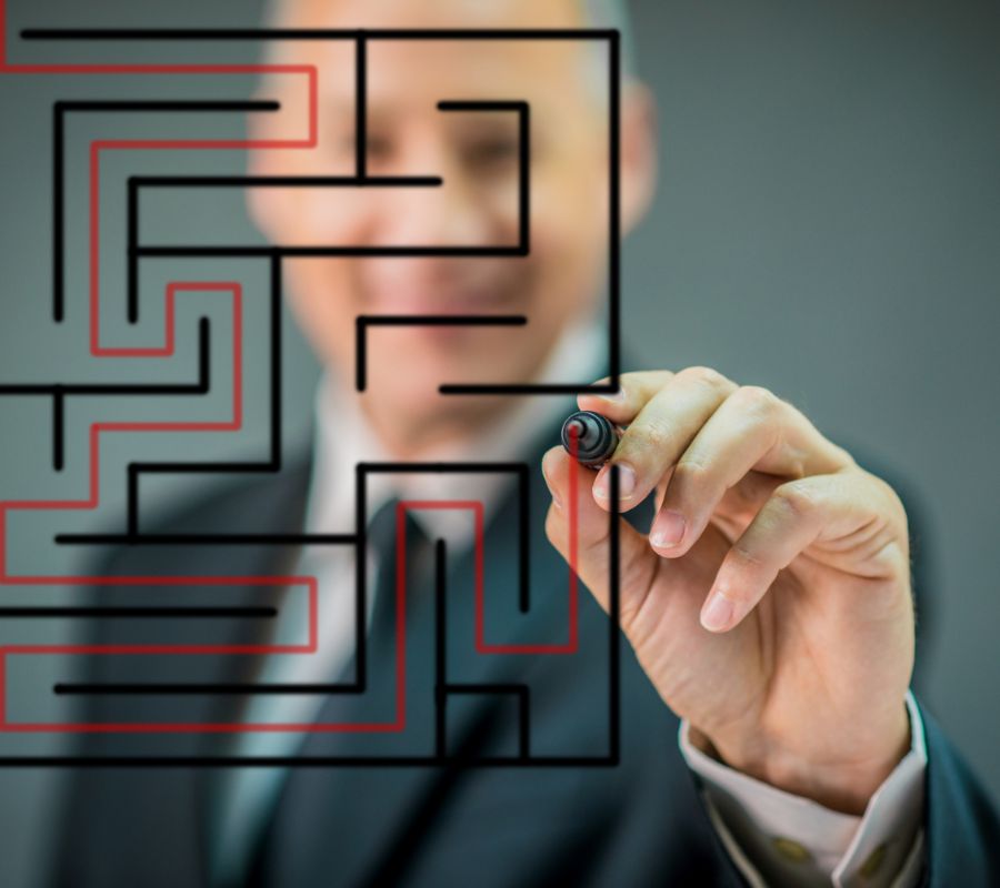 man drawing a maze on screen