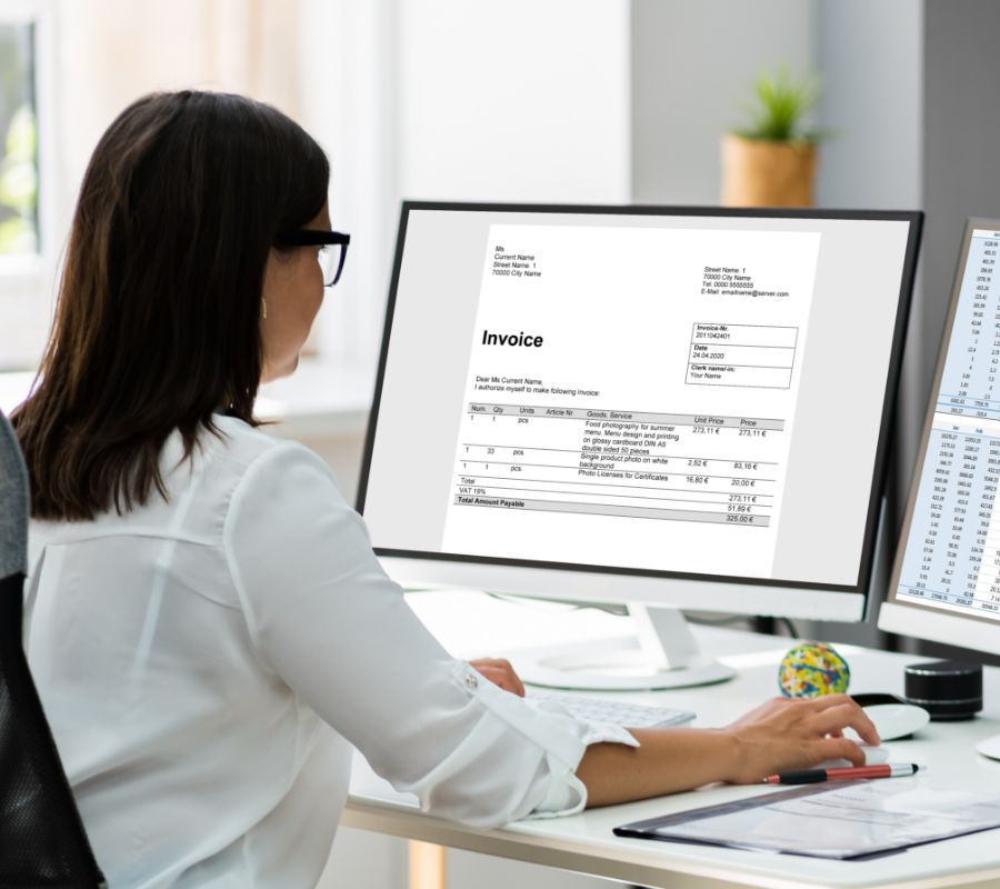 Stock image of woman working in front of a screen.